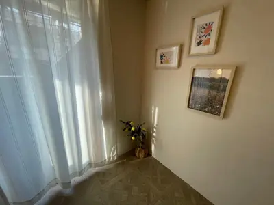 a room with a window and a vase of flowers at HARMONIa\u6771\u4eac\u5800\u5207202 in Tokyo