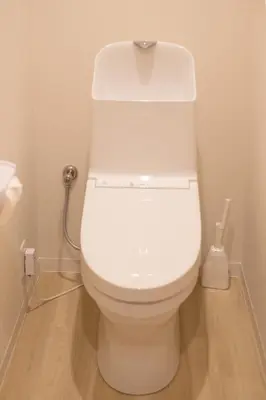 a bathroom with a white toilet in a room at Six7 APT\u4e09\u30ce\u8f2a in Tokyo
