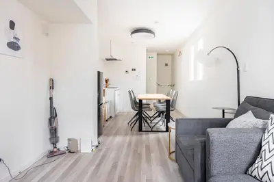 a living room with a couch and a table at \u65b0\u4e951\u4e01\u76ee in Tokyo