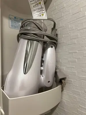 a white appliance in a holder in a wall at \u65b0\u4e951\u4e01\u76ee in Tokyo