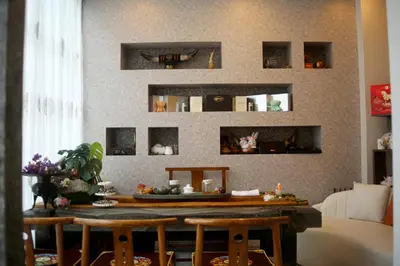a room with a table and some mirrors on the wall at MIYAVI hotel in Tokyo