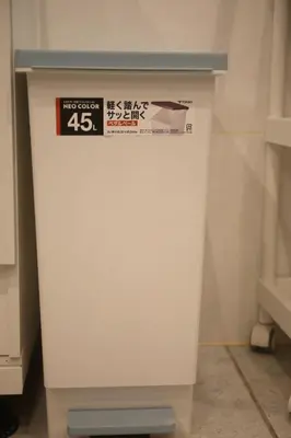 a white refrigerator with a sign on top of it at MIYAVI hotel in Tokyo