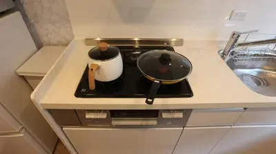 a pot on a stove in a kitchen at MIZUKEN Home With Living Room And Sofa Bed in Tokyo