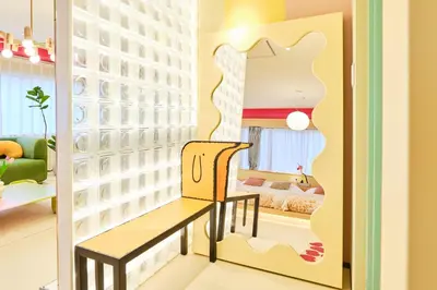 a dressing room with a bench and a mirror at \u5bc5\u30db\u30c6\u30eb \u5fa1\u5f92\u753a TORA HOTEL Okachimachi in Tokyo