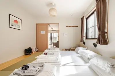 a room with four beds in a row in a room at Tokoryokan - Takasago - Vacation STAY 58684v in Tokyo