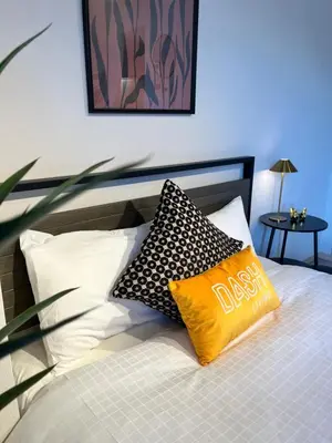 a bed with two pillows sitting on top of it at Dash Living Ryogoku in Tokyo
