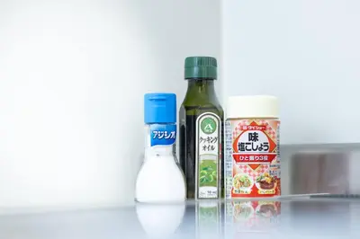 a shelf with a bottle of oil and a container of food at NishiShinjuku5chome sta 5 mins walk Max 5 people in Tokyo