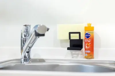 a bathroom sink with a faucet and a soap dispenser at NishiShinjuku5chome sta 5 mins walk Max 5 people in Tokyo