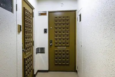 a green door in a hallway of a building at NishiShinjuku5chome sta 5 mins walk Max 5 people in Tokyo