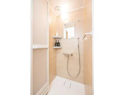a bathroom with a shower and a toilet at ZAITO TOKYO RYOGOKU Hotel in Tokyo