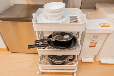 a kitchenrolley with dishes and plates in a refrigerator at ZAITO TOKYO RYOGOKU Hotel in Tokyo