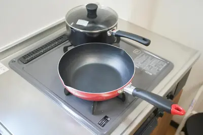 a pan on a stove with a pot on it at Asakusa 5 Chome One Bedroom KazeNoItsu 201 in Tokyo