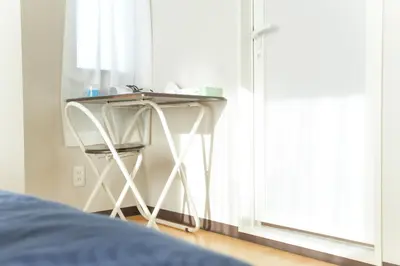 a table next to a window next to a bed at Asakusa 5 Chome One Bedroom KazeNoItsu 401 in Tokyo