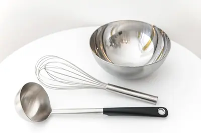 a whisk and a bowl on a white plate at FIKA Shibuya Honmachi 201 in Tokyo