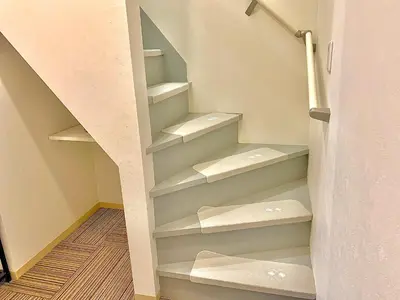a closet with white shelves and a staircase at Luna House ASAKUSA TOKYO SKYTREE in Tokyo