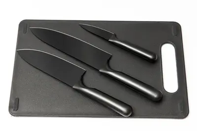 a black tray with three knives on it at FIKA Shibuya Honmachi 301 in Tokyo