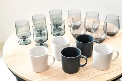 a group of glasses and mugs on a table at FIKA Shibuya Honmachi 301 in Tokyo