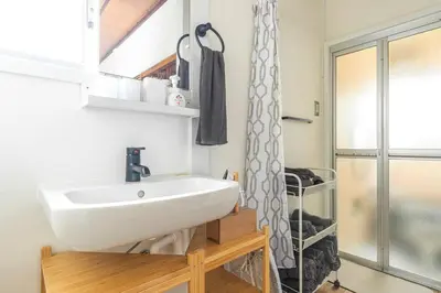 a bathroom with a white sink and a shower at Ohanajaya 3min Garden View House 4 beds in Tokyo