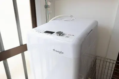 a small white refrigerator in a room with a window at Ohanajaya 3min Garden View House 4 beds in Tokyo