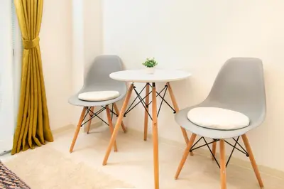 two chairs and a table in a room at FIKA Shibuya Honmachi Entire building in Tokyo