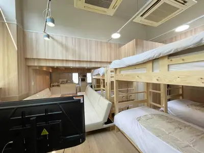 a room with two bunk beds and a kitchen at Yamato Residence Katsushika,10min toAsakusa Japanese style 1LDK Max10ppl in Tokyo