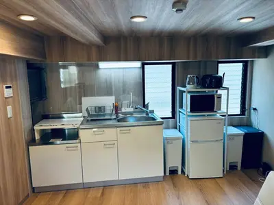 a kitchen with a sink and a microwave at Yamato Residence Katsushika,10min toAsakusa Japanese style 1LDK Max10ppl in Tokyo