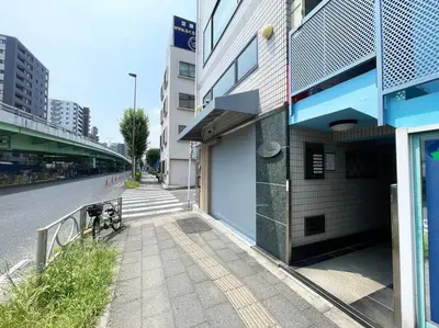 a building with a bike parked next to a street at Yamato Residence Katsushika,10min toAsakusa Japanese style 1LDK Max10ppl in Tokyo