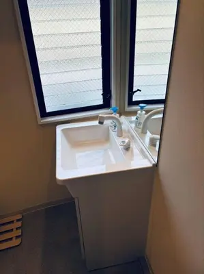 a bathroom with a sink and a window at Yamato Residence Katsushika,10min toAsakusa Japanese style 1LDK Max10ppl in Tokyo