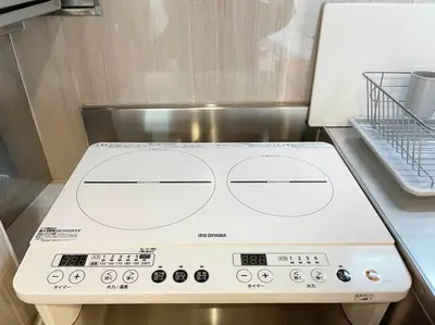 a stove top oven sitting on top of a shelf at Yamato Residence Katsushika,10min toAsakusa Japanese style 1LDK Max10ppl in Tokyo