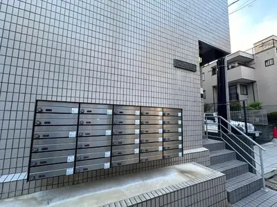 a building with a bunch of lockers on the side of it at Akabane Apart ment Wei hefuyan7190 in Tokyo