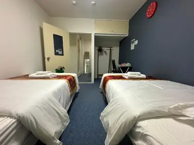 a room with two beds in a room at Akabane Apart ment Wei hefuyan7190 in Tokyo