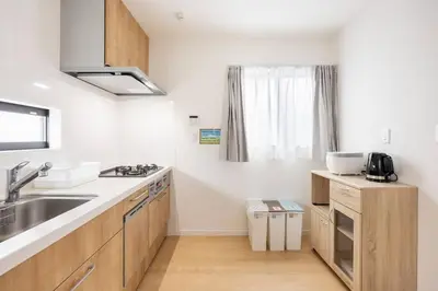 a kitchen with a sink and a counter top at \u6771\u5411\u5cf66\u4e01\u76ee in Tokyo