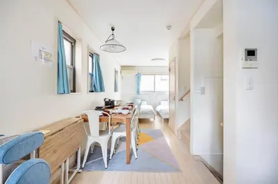 a kitchen and dining room with a table and chairs at \u5927\u5cf67\u4e01\u76ee in Tokyo