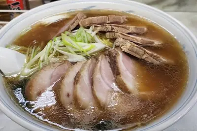 a bowl of soup with meat and vegetables in it at \u5927\u5cf67\u4e01\u76ee in Tokyo