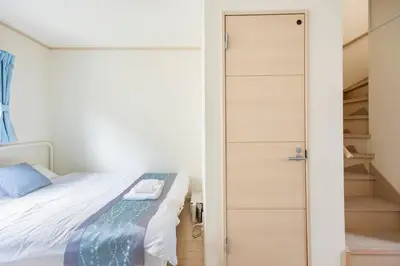 a small bedroom with a bed and a closet at \u5927\u5cf67\u4e01\u76ee in Tokyo