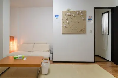 a living room with a couch and a table at \u9ce5\u8d8a\u4e00\u6237\u5efa in Tokyo