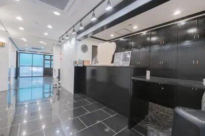 a large room with black cabinets and a pool at Minutes from Sumiyoshi & Iconic Attractions & Sky Tree in Tokyo