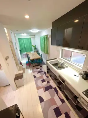 a kitchen with a sink and a table in it at Crown\u6d77\u8fba in Tokyo
