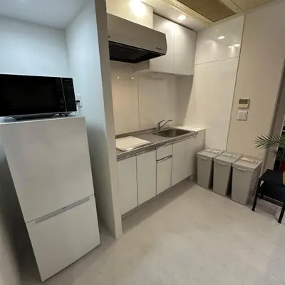 a small kitchen with a sink and a refrigerator at Style Lab\u304a\u82b1\u8336\u5c4b1 in Tokyo