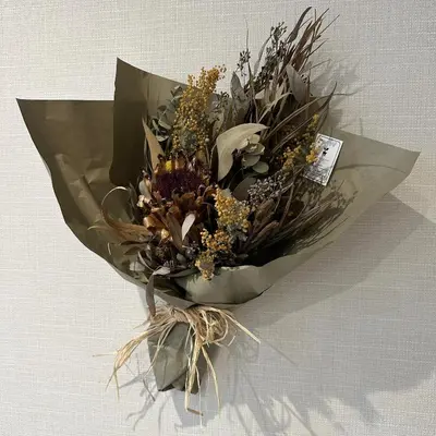 a bouquet of dried flowers in a paper at Style Lab\u304a\u82b1\u8336\u5c4b1 in Tokyo