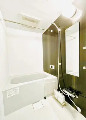 a white bathroom with a sink and a mirror at Class Kyodo in Tokyo