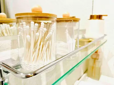a glass shelf with a bunch of white tooth brushes at Class Kyodo in Tokyo