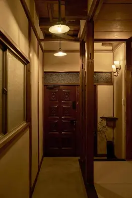 a hallway with a door and a room with aumbledore at Rojiura in Tokyo