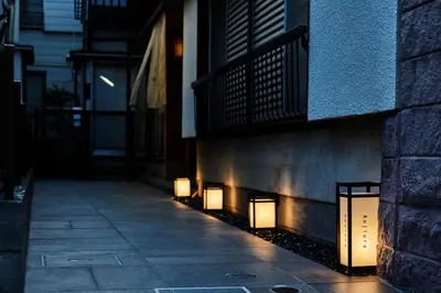 a group of lights on the side of a building at Rojiura in Tokyo