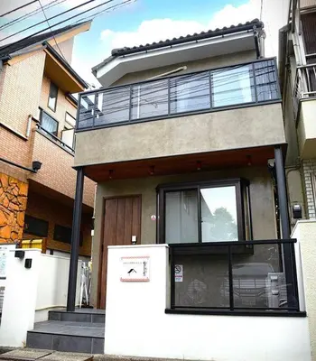 a house with a refrigerator in front of it at \u9ad8\u5186\u5bfa\u4e2d\u91ceVilla in Tokyo
