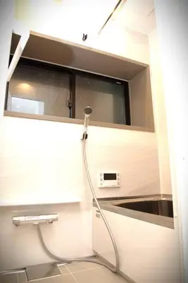 a bathroom with a shower with a hose at \u9ad8\u5186\u5bfa\u4e2d\u91ceVilla in Tokyo