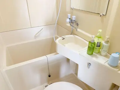a small bathroom with a sink and a toilet at Shinjuku Area!Nishi-Shinjuku Gochome subway 6 minutes walk! \u897f\u65b0\u5bbf\u4e94\u4e01\u76ee\u8f66\u7ad9\u6b65\u884c6\u5206\u949f! \u9ad8\u901f\u65e0\u9650\u5236WIFI #\u9ad8\u901f\u7f51\u7edc#201 in Tokyo