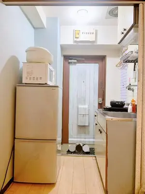 a kitchen with a refrigerator and a microwave at Shinjuku Area!Nishi-Shinjuku Gochome subway 6 minutes walk! \u897f\u65b0\u5bbf\u4e94\u4e01\u76ee\u8f66\u7ad9\u6b65\u884c6\u5206\u949f! \u9ad8\u901f\u65e0\u9650\u5236WIFI #\u9ad8\u901f\u7f51\u7edc#201 in Tokyo