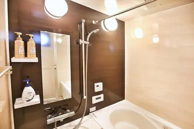 a bathroom with a shower and a sink at \u30a2\u30ad\u30e9\u5546\u4e8b in Tokyo