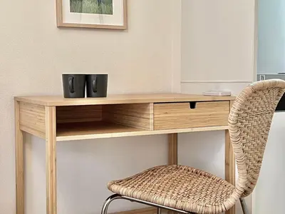 a wooden desk with a chair in a room at Shinjuku YC Hostel-SJ0399 in Tokyo